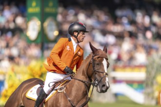 Willem Greve of the Netherlands, riding Pretty Woman Van't Paradujs, competes in the first round of