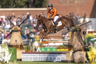 Willem Greve of the Netherlands, riding Pretty Woman Van't Paradujs, competes in the first round of