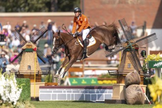Willem Greve of the Netherlands, riding Pretty Woman Van't Paradujs, competes in the first round of