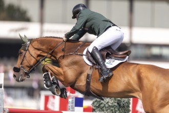 Jordan Coyle of Ireland, riding Chaccolino, competes in the first round of the 2025 BMO Nations Cup