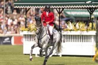 Roy Van Beek of Belgium, riding Cavoiro-H Old, competes in the first round of the 2025 BMO Nations