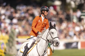 Kevin Jochems of the Netherlands, riding Camilla Van de Helle, competes in the first round of the