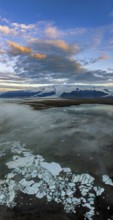Ice floes, glacier, glacier lake, glacier lagoon, morning light, cloudy mood, panorama, summer,