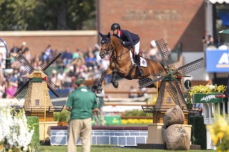 Ben Maher of England, riding Enjeu De Grisien, competes in the first round of the 2025 BMO Nations