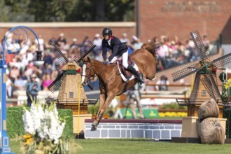 Kevin Staut of France, riding Queens Balou B, competes in the first round of the 2025 BMO Nations