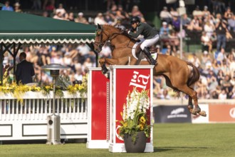 Gabriel De Matos Machado of Brazil, riding Nyles Van de Mottelhoeve, competes in the first round of
