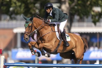 Gabriel De Matos Machado of Brazil, riding Nyles Van de Mottelhoeve, competes in the first round of