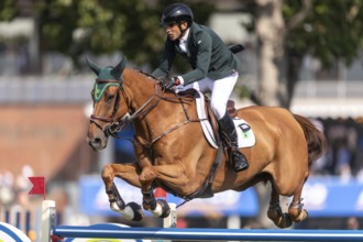 Gabriel De Matos Machado of Brazil, riding Nyles Van de Mottelhoeve, competes in the first round of