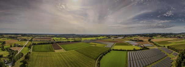 The panoramic view shows an expansive rural landscape in Germany, criss-crossed by fields and