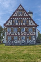 Pointed gable façade with half-timbering next to the hospital chapel in Bärenweiler from 1619 near