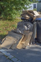 Overfilled paper bins in Eglofstal, Allgäu, Baden-Württemberg, Germany