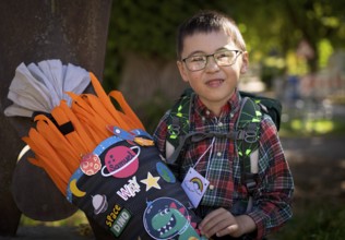 Boy, 6 years, glasses, multi-ethnic, on the day of enrolment in first grade of primary school,