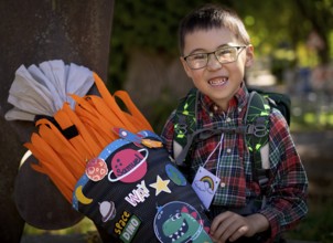 Boy, 6 years, glasses, multi-ethnic, on the day of enrolment in first grade of primary school,