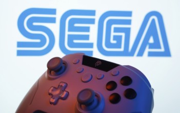 Dhaka, Bangladesh- 13 Sep 2025: A close-up of a gamepad with the Sega seen on screen in the