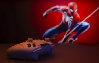 Dhaka, Bangladesh- 13 Sep 2025: Game controller in front of Marvel's Spider Man on a background