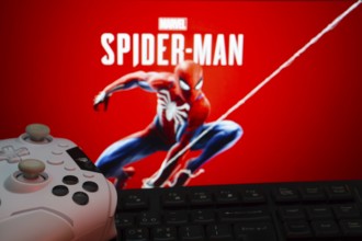 Dhaka, Bangladesh- 13 Sep 2025: Game controller in front of Marvel's Spider Man on a background
