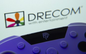 Dhaka, Bangladesh- 12 June 2025: A close-up of a gamepad with the Drecom seen on screen in the