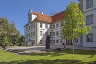 New castle with wooden sculpture by Klaus Prior in Kisslegg, Allgäu, Baden-Württemberg, Germany
