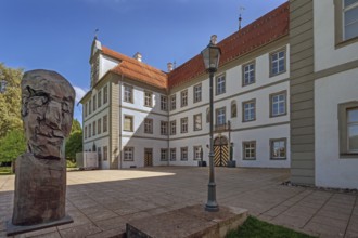 New castle with wooden sculpture by Klaus Prior in Kisslegg, Allgäu, Baden-Württemberg, Germany