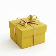 A square yellow gift box is elegantly tied with a golden ribbon and bow, perfect for celebrations
