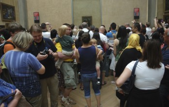 Louvre Museum, visitors in front of the Mona Lisa. redactional use only