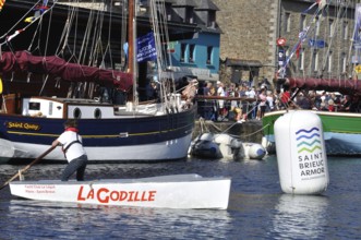 Sculling demonstration at the Solitaire du Figaro in Plérin in Brittany, France redactional use