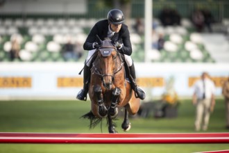 Max Kuhner of Austria, riding Elektric Blue P, competes in the 2025 Spruce Meadows Masters on