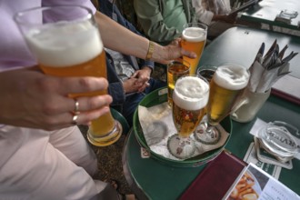 Drinks are served on a tray in a garden restaurant, Franconia, Bavaria, Germany