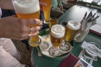 Drinks are served on a tray in a garden restaurant, Franconia, Bavaria, Germany