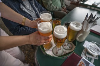 Drinks are served on a tray in a garden restaurant, Franconia, Bavaria, Germany