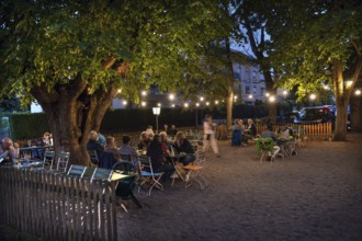 Illuminated garden restaurant in the evening, Erlangen, Middle Franconia, Bavaria, Germany