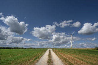 Field path and wind turbine in Franconian landscape, Karsberg, Upper Franconia, Bavaria, Germany