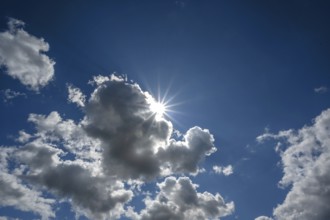 Sunstar on a rain cloud (Nimbostratus), Bavaria, Germany