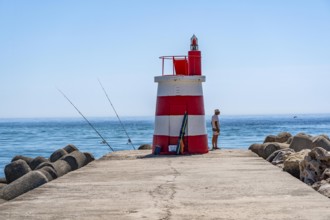 Lighthouse at the kilometre-long beach Praia da Ilha de Tavira, on the island in front of Tavira,