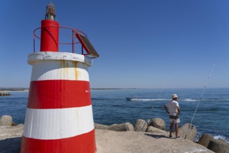 Lighthouse at the kilometre-long beach Praia da Ilha de Tavira, on the island in front of Tavira,