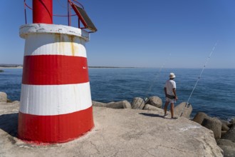 Lighthouse at the kilometre-long beach Praia da Ilha de Tavira, on the island in front of Tavira,