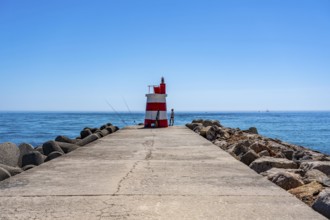 Lighthouse at the kilometre-long beach Praia da Ilha de Tavira, on the island in front of Tavira,