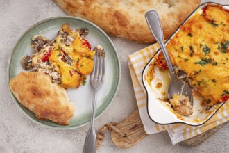 Madame Bovary's Georgian dish, chicken fillet with mushrooms, tomatoes and cheese, baked in a mold