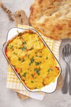 Madame Bovary's Georgian dish, chicken fillet with mushrooms, tomatoes and cheese, baked in a mold