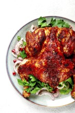 Whole fried chicken, with spices, grilled chicken, on a light background, top view, homemade, no