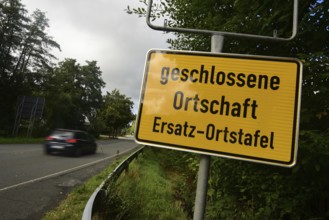 Instead of the usual place name sign, a replacement place name sign has been installed in the