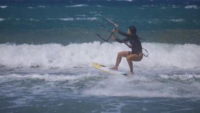 Photo of a kitesurfer jumping over the waves of the ocean, Prasonisi, beach, surf, windsurfer, kite
