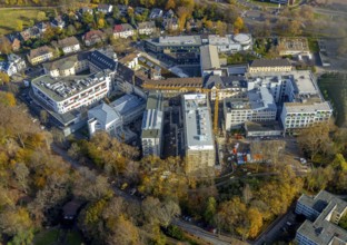 Construction site at St. Josef Hospital Bochum with trees in autumn colours, Bochum, Ruhr area,