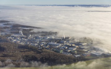 Aerial view, industrial area Westerhaar in fog and mountains of the Sauerland in backlight in