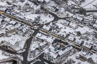 Aerial view of the snowy winter landscape of Winterberg with deserted streets during the corona