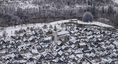 Aerial view of the snowy winter landscape of Winterberg with deserted streets during the corona