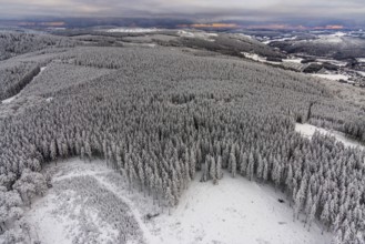 Aerial view of the snowy winter landscape of Winterberg in Sauerland in North Rhine-Westphalia,