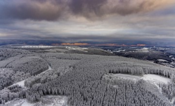 Aerial view of the snowy winter landscape of Winterberg in Sauerland in North Rhine-Westphalia,