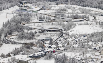 Aerial view of the snowy winter landscape of Winterberg with the VELTINS-EisArena Winterberg