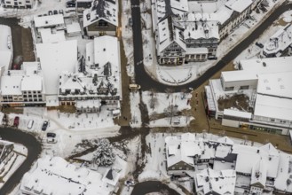 Aerial view of the snowy winter landscape of Winterberg with deserted streets at the market in the